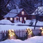 lights lassoed over rails of a garland draped fence